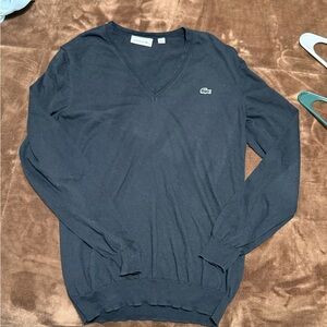 Woman’s Lacoste Sweater size 42 which is a size large I believe